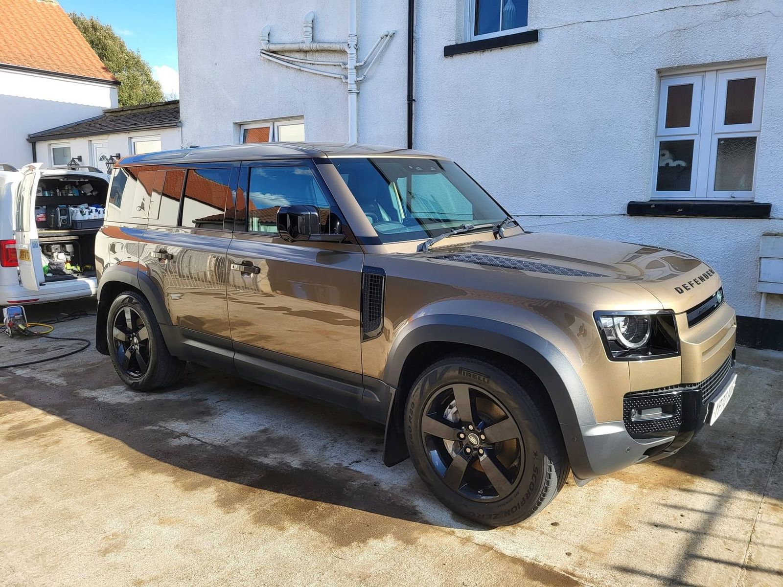 The same four-wheel drive after valeting, bodywork glossy and wheels clean in the sunshine